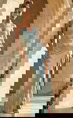 Front view of fitted embellished gown with ruched bodice, thin straps, and thigh high slit