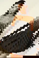 Black strapless mini cocktail dress with crystal embellished bodice and bubble skirt hem, styled with sheer black gloves and matching choker necklace