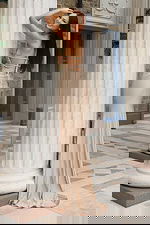 Sparkly pink gown with rhinestone halter straps and smooth satin skirt