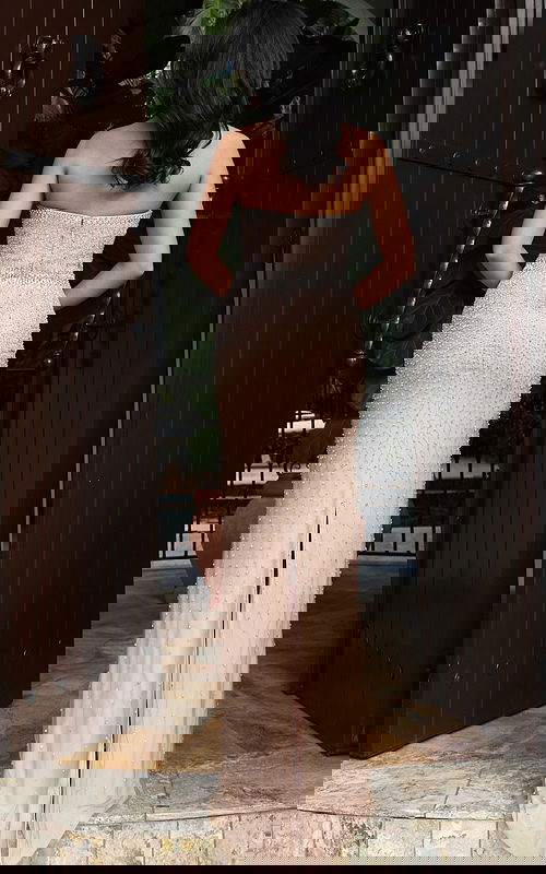 Jovani 48147 nude silver strapless fitted gown back view showing graduated crystal and pearl beading, zipper closure, and back slit