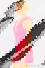 Side profile of black cocktail dress with rose embellishments