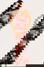 Strapless floral metallic gown with fitted silhouette, bold red and gold print, and matching draped scarf accent.