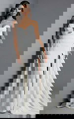 Elegant fitted evening gown with structured bodice and flowing skirt,