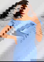 Off-shoulder mermaid gown with structured draped neckline and smooth fitted silhouette flowing into a flared hem.