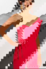 Close-up of structured bodice with folded detail and tied waist on red jumpsuit