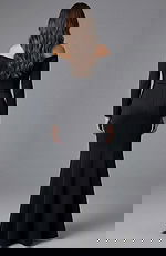 Back view of off shoulder formal gown with long sleeves and clean lines