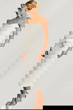 Strapless off-white midi dress with structured bodice and large satin rose detail at the hip