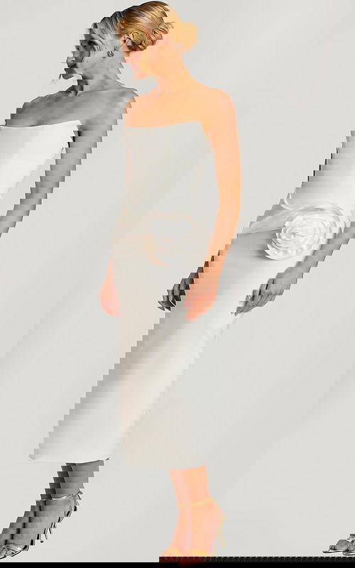 Strapless off-white midi dress with structured bodice and large satin rose detail at the hip