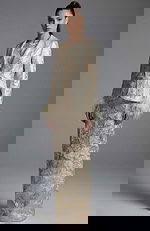 Front view of tailored brocade jacket with matching column skirt ensemble