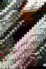 Shimmering layered metallic dress with open back and flowing silhouette