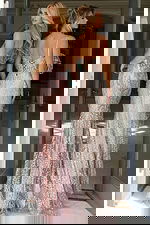 fitted lace gown with lace up corset back and sheer detailing