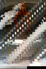 Beaded lace evening gown with spaghetti straps and deep V neckline