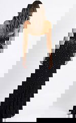 Back view of fitted halter gown with open back, gathered detailing, and floor length silhouette