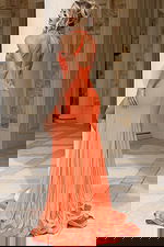 Elegant coral prom dress with backless design and side slit for formal events, galas, and red carpet occasions.