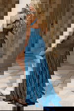 Back view of one shoulder shimmer gown with high slit