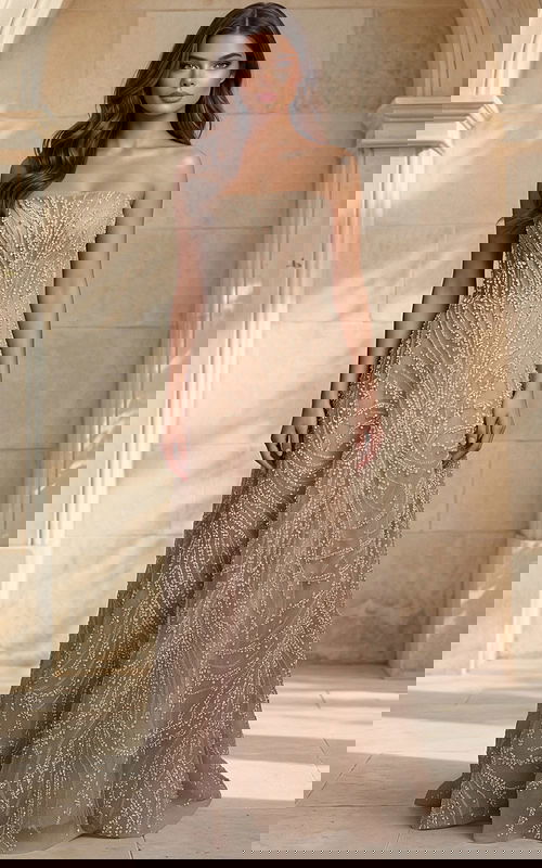 Strapless beaded bridal gown with flowing skirt and detailed texture