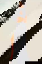 Luxe black velvet evening dress with asymmetric sleeve, rhinestone details, and side slit for formal events