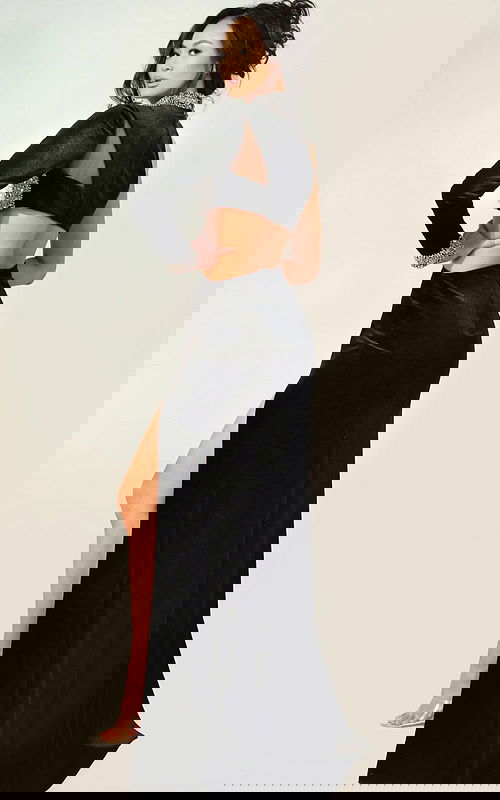 Luxe black velvet evening dress with asymmetric sleeve, rhinestone details, and side slit for formal events