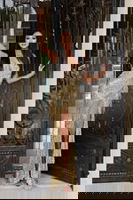 Gold V neck sequin prom dress with thigh-high slit and beaded design