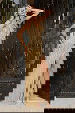 Beaded gold prom dress with halter neckline and sequin fringe skirt