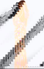 Fitted nude gown featuring colorful beadwork and open back design