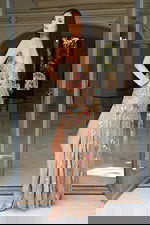 Back view of sheer beaded gown with spaghetti straps and open back