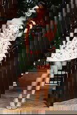 Jovani 48584 ivory multi strapless short A line dress with colorful beaded floral embellishments in red, purple, teal, and pink on a sequin covered base