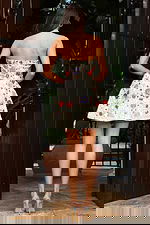 Jovani 48584 ivory multi strapless short A line dress back view showing colorful beaded floral embellishments in red, purple, teal, and pink scattered across the sequin covered skirt