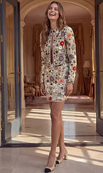 Structured long-sleeve jacket and matching fitted mini skirt set with detailed botanical beadwork and sequin embellishments.