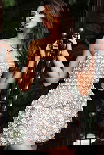 Jovani 48592 nude ivory strapless mini dress close up showing detailed scalloped beadwork with pearl and crystal fan motif on sheer nude base