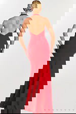 Back view of low-cut halter red gown with zipper detail