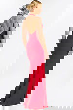 Rear side angle of red halter gown with soft train and fitted waist