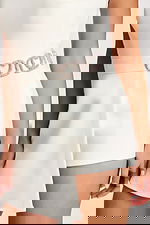 Side view of the rhinestone heart belt and asymmetric overlay skirt