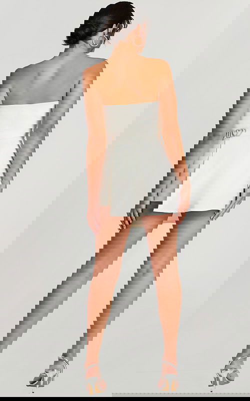 Back view of the strapless ivory romper with fitted waist