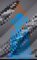 Front view of strapless printed gown with structured bodice, cascading ruffle detail, and matching draped wrap