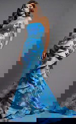 Front view of strapless printed gown with fitted bodice, sculpted waist, and cascading ruffle skirt