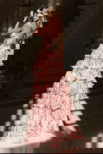 Strapless floral dress featuring layered ruffles and high slit