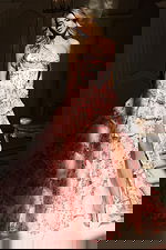 Elegant printed gown with cascading ruffled skirt and fitted corset