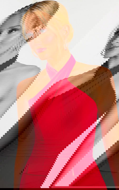 Close-up of red halter-style neckline and pleated waist detailing