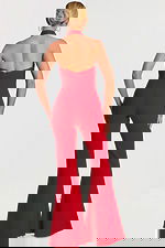 Back view of red jumpsuit showing open back and flared legs