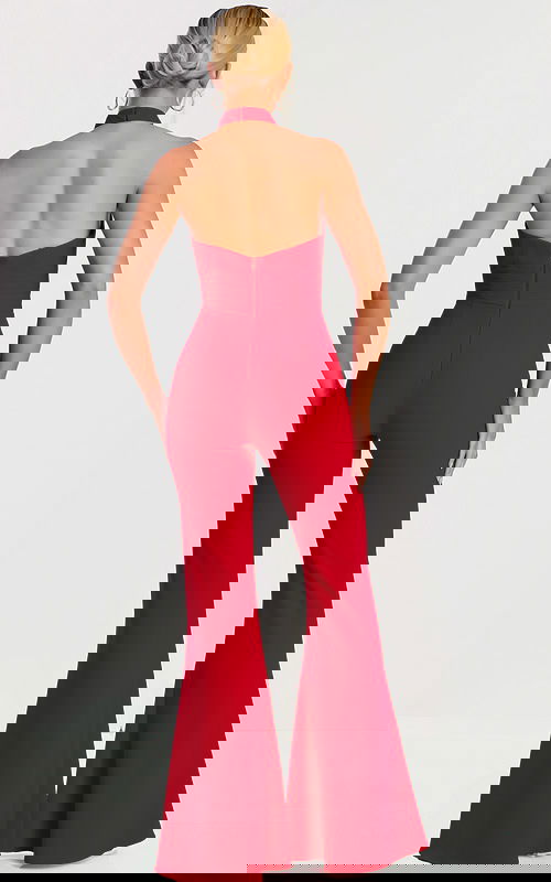 Back view of red jumpsuit showing open back and flared legs