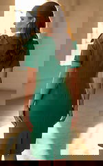 Elegant knee length fitted dress featuring structured bow accent on the shoulder