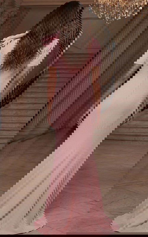 Back view of fitted floor length gown with clean silhouette