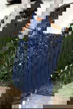 back of navy dress with sheer shawl 48990