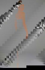 One shoulder metallic evening gown with peplum detail and back slit