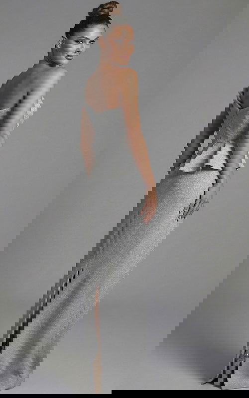 One shoulder metallic evening gown with peplum detail and back slit