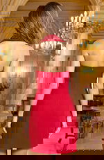 Back view of halter mini dress with clean lines and fitted silhouette