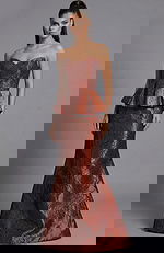 Strapless brocade evening gown with structured bodice and peplum waist