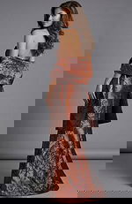 Back view of strapless brocade gown with bow detail and long skirt