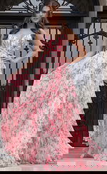 Front view of flowing floral evening gown with twisted waist detail and pleated skirt